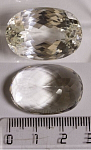 Сподумен зеленовато-желтого оттенка. Размер 27,6х19,2х14,5мм. 62,02 ct .  Чистота WS. Огранка № 10.7